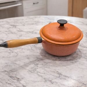 Orange Cast Iron Saucepan with Wooden Handle